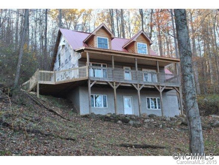 New construction! Cape Cod style home w/ wrap around decks, metal roof, & chink siding. Drive allows you to pull up to the back of the home w/ just a few steps to the kitchen. Interior features open floor plan w/ vaulted T & G ceilings, granite tops w/ breakfast bar, master on main, & master bath w/ jet tub. Large loft up & family room w/ fireplace in lower level. 1 car garage! Holiday Special: Free Stainless Appliances!