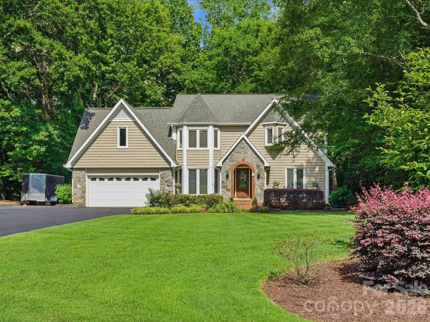 Beautifully maintained home situated on nearly an acre in Fort Mill offering privacy, space, and years of thoughtful improvements throughout. Surrounded by mature trees with NO HOA and NO city taxes, this property provides the peaceful setting buyers are looking for while still being incredibly convenient to shopping, dining, and everyday essentials.

Inside, you’ll find a spacious and functional layout with 4 bedrooms, 3.5 bathrooms, multiple living spaces, a dedicated office, bonus room with closet, and beautifully updated spaces throughout the home. The kitchen was thoughtfully redesigned with new cabinets and granite countertops. The main living areas flow seamlessly into the screened porch, large Trex deck, and beautifully designed outdoor living spaces.

One of the most unique features of this home is the main level bedroom with an updated en suite with new acrylic shower and granite vanity, two closets, and its own separate exterior entrance, creating the perfect setup for guests, multi-generational living, a private home office, or flexible bonus space.

The primary suite offers a private retreat with an updated bathroom featuring a large walk-in shower, jacuzzi tub, granite vanity, and custom closet updates. Upstairs, there are 3 additional generously sized bedrooms and a bonus space with a closet.

Outdoor living is truly one of the standout features of this property. Enjoy a spacious screened porch, expansive Trex deck with updated iron balusters (2024), paver patio with built-in seating and firepit, established landscaping, irrigation system (2022), storage shed, and a backyard surrounded by trees for added privacy. With nearly an acre, there is still plenty of room to add a pool or customize the backyard however you envision.
This home has been meticulously cared for over the years with major improvements already completed, including whole house water softener and filtration system (2023), and crawlspace treatment with new R19 insulation completed in 2026.

Located just minutes from RedStone in Indian Land, downtown Fort Mill, restaurants, grocery stores, shopping, and everyday conveniences while also being zoned for highly desirable Fort Mill schools including Catawba Ridge High School.
