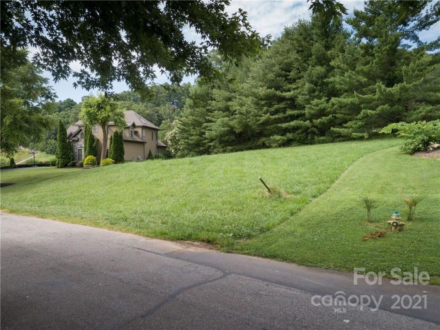 You will not find a better lot in High Vista!  This is one of the few remaining lots that are TC Roberson school district. The mostly cleared lot is gently rolling and offers year round mountain views in the distance.
This lot has all the utilities available at the street, and is ready to go! Included with this lot, is a membership to the POA.  This membership lets you access the swimming pool, tennis courts, country club with restaurant, and play ground. Enjoy all this in the safety of a gated neighborhood.