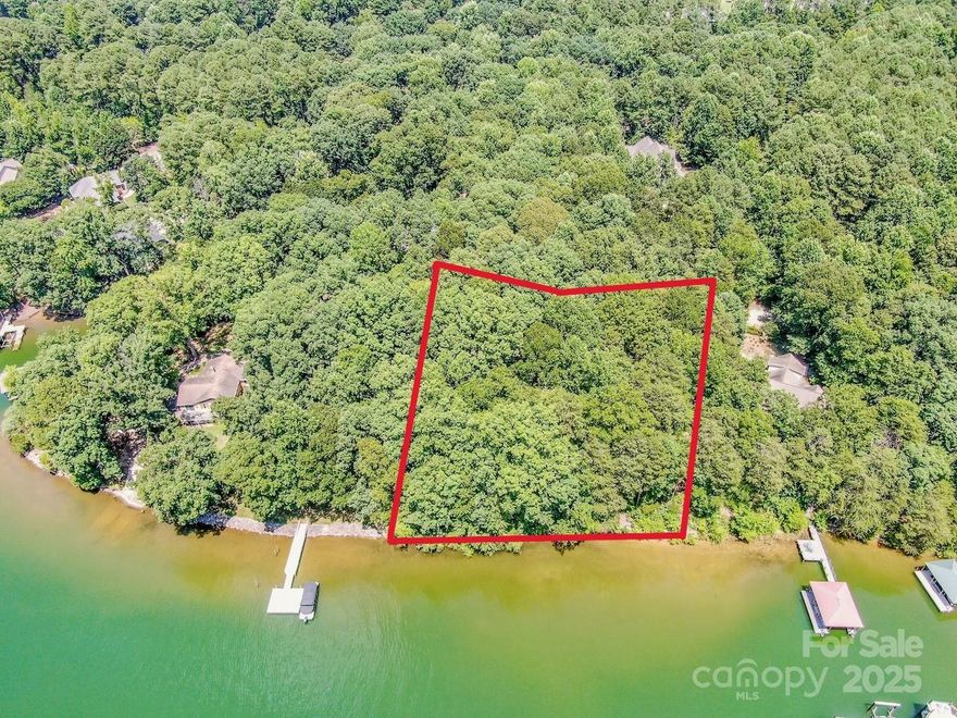 Rare Lake Norman Waterfront Opportunity .69 Acre with Big Water Views & Cabin. Come experience the charm & potential of this lot boasting 174 feet of shoreline, gorgeous water views & beautiful canopy of hardwoods. Whether you’re looking to build your dream lakefront home or enjoy a peaceful retreat today, this property offers the best of both worlds. Rustic unpermitted one-bedroom cabin already in place, perfect for weekend getaways, use while planning your future build. Enjoy lake life right away as you envision the possibilities. Just off River Highway & poised to become even more convenient with the ongoing road widening project, promising faster access to Mooresville, I-77. Minutes from all your local amenities, yet with the peace and privacy of lakeside living. No HOA. Whether you're looking for a private retreat, a future home site, or a smart investment on Lake Norman, this one-of-a-kind property is full of potential. Visit today & start planning your lakefront lifestyle!