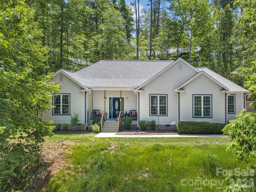 Located in the prestigious Lake Adger community, this home offers a perfect blend of privacy and refined mountain living. This very well-maintained, one-level home is situated on a sprawling 3.09-acre lot, providing a serene sanctuary where nature is your closest neighbor. The home features an expansive open floor plan defined by soaring ceilings and graceful arched entryways. The great room is anchored by a magnificent floor-to-ceiling stone fireplace with gas logs. Designed for entertaining, the kitchen boasts a spacious breakfast bar that flows seamlessly into a sun-drenched breakfast nook set within a classic bay window. A true retreat, the primary bedroom features elegant tray ceilings and a large private bath with a jacuzzi tub and dual walk-in closets. Enjoy the crisp mountain air from the front porch or host summer gatherings on the oversized back deck, which steps down into a perfectly level, easy-to-maintain yard. Recent upgrades completed in 2025 include a new roof and gutter guards, new induction range with electric oven, built in microwave, freshly painted rooms, ceiling fans, updated deck, cable rails with gates, an engineered retailing wall for the back yard and a large 12x16 storage shed. This home is move in ready! Lake Adger Residents enjoy access to one of Western North Carolina’s most beautiful waterways, including a boat ramp, lake access, and a private community pavilion. Lake Adger encompasses 14 miles of shoreline and 438 surface acres of water, ideal for boating, kayaking, fishing, and swimming. The Lake Adger Community is a private, planned development covering approximately 3,250 acres, featuring 13 miles of private equestrian and hiking trails. This location is conveniently accessible from Asheville and Hendersonville, NC, as well as Greenville and Spartanburg, SC.