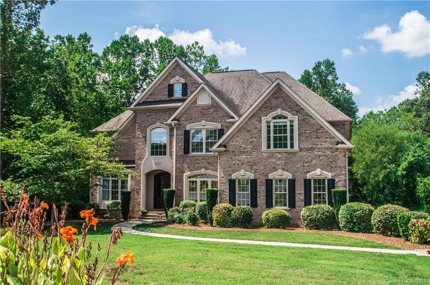 A strikingly luxurious cul-de-sac water view home offering private outdoor pool on 0.66 acres lot. Opulent living space affords grandeur for entertaining ,two story great room with fireplace. Exquisite details & upgrades abound in this stunning 4BR 5 baths + bonus/bed. Home has an open floorplan, custom moldings & cabinetry, custom gourmet kitchen, sumptuous master suite & spa bath, entertainers dream finished lower level includes bar.  Boatslip for summer lake days!