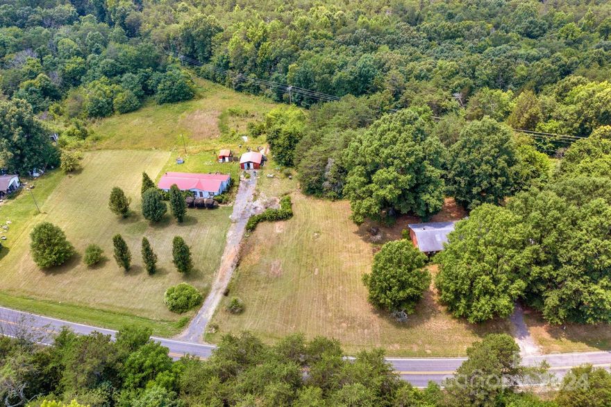 Incredible opportunity for 6+ acres in highly sought-after Mooresville! There is a brick ranch on the property with an almost new roof, new HVAC system & new septic motor. There is also a 2nd residence on the property. Both properties are being sold as-is. The real value is in the land!!! The potential is endless for the right buyer!