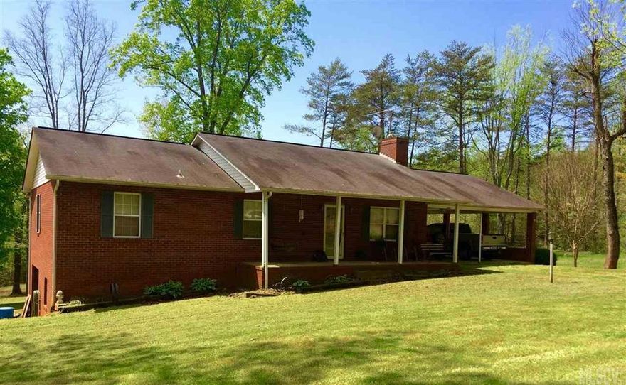 REMARKS: Private 3 bedroom 2 bathroom home. Enjoy one level living with a full unfinished basement for all your storage or hobby needs. Walk into a large living room centered around a floor to ceiling stone fireplace with wood burning insert and wood mantel. From the living room, step into a large eat-in kitchen complete with a bar height island. Sit at your dining table and see the mountain views or open the sliding glass doors and bring the outdoors in. Enjoy breakfast outside on the deck and watch the wildlife play in your back yard. Down the hallway you will find the master bedroom complete with walk in closet and en suite bathroom. Bedrooms two and three are located across the hall from the second full bathroom. Home also has a full unfinished basement with garage door and interior access. Home has hardwood floors. Home is located 30 miles from South Mountain State Park and 13 miles from Lake James State Park.