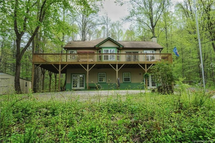 This spacious house awaits a loving family to live in.  Plenty of room to roam on the private and wooded 12.6 acres. The house is very family friendly with room for everyone.  Two large  bedrooms and two baths on the main level with large closets.  Off the kitchen but still within the great room is a built in computer/desk area.  The third bedroom and bath is down stairs, it could be separate living quarters.  There you will also find a large den, laundry area and a workshop/man cave area.