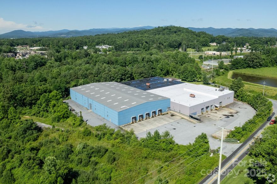 Excellent 122,397/sf Manufacturing/Warehouse in South Asheville.  There is a tenant in place until 10/2/2026 at $8.00/sf.  Two buildings side-by-side Manufacturing/Warehouse.  30'x40' and 20'x30' column spacing.  8 truck docks, 2 drive-in doors, about 11,000/sf of offices.  High ceilings - 24' and 36' depending on which building you are in.