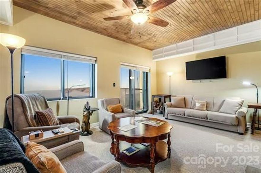 Enjoy stunning long range mountain views overlooking the ski slopes from this beautifully updated 2BR/2BA Sugar Top condo, offered fully furnished and ready to enjoy, or put in a rental program! The kitchen features granite countertops, glass tile backsplash, under cabinet lighting and stainless appliances. Wood ceilings throughout give the unit a warm and inviting mountain feel. Flooring has been updated to include wood-look tile in the foyer, dining area and kitchen, while the primary bathroom boasts marble floors and updated finishes. The amenity-rich Sugar Top community offers an indoor swimming pool sauna, hot tub, fitness center, front desk, and 24-hour security. Great, central location just minutes from Sugar Mountain Ski resort, downtown Banner Elk, Beech Mountain, Grandfather Mountain and all that the High Country has to offer!