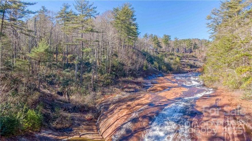 Bordering beautiful Lake Towaway Falls--here is your chance to own an exceptional waterfront property! The views of the falls and underlying exposed rock are exceptional! This +/- 0.935 acre parcel yields breathtaking views of the falls (protected by a view easement)! The relaxing sound of rushing water, views, and functional topography ensure that this truly is a one-of-a-kind parcel. Just steps away from Gorges State Park, take advantage all of the outdoor recreational areas that put Lake Toxaway on the map. Minutes away from downtown Brevard and downtown Cashier's, you will enjoy all the best shopping, dining, fishing, hiking, and biking. This would make a prime location for your next primary residence, vacation home, and or investment property. This property IS NOT part of the Lake Toxaway Falls POA! Inquire today!