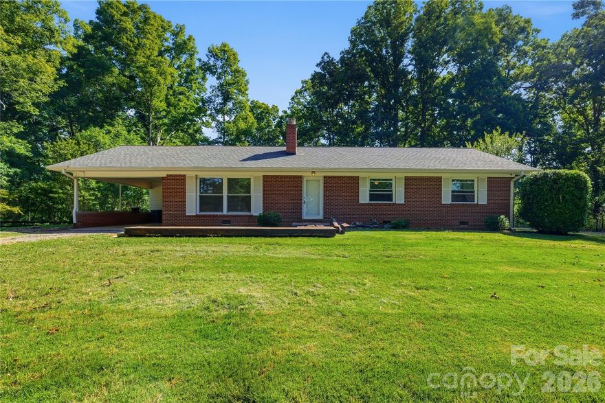 Nestled on 20 beautiful wooded acres in the heart of Forest City, this charming single-story home offers the perfect blend of comfort, privacy, and country living. Featuring 3 bedrooms and 2 full bathrooms, the home welcomes you with warm wood flooring throughout, updated lighting, and a spacious, functional layout designed for everyday living. The beautiful living room is centered around a large fireplace, creating a warm and inviting focal point, while oversized windows fill the space with natural light and showcase the peaceful views of the surrounding property.
Relax and unwind on the back deck while taking in the serene setting of mature trees and the frequent visits from deer and other wildlife right outside your back door. Outside, you’ll find a convenient carport and a 2-stall barn complete with tack rooms — ideal for horses, hobby farming, or extra storage. With 20 acres of privacy and endless possibilities, this property is a rare opportunity to enjoy quiet rural living while still being close to town conveniences.