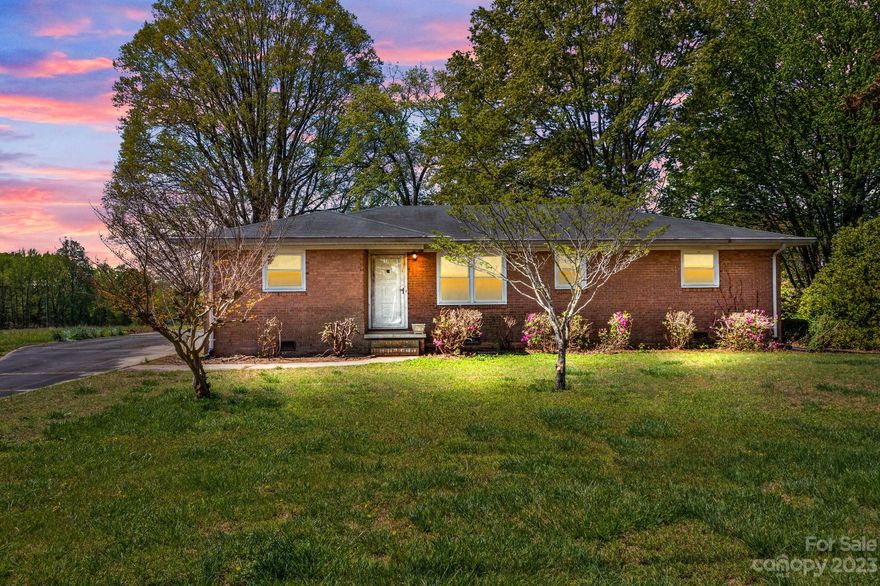 This spacious all-brick home is located in a quiet neighborhood with a convenient location, just minutes from Hwy 29 and I-85. It is perfect for anyone looking for a large, private backyard with space to entertain, garden, or just relax under the shade trees. With 3 bedrooms, 2 bathrooms, and a flex room, this home offers ample space for comfortable living. The large kitchen has plenty of natural light making it feel bright and inviting. You'll love the brick fireplace and small built-in bookshelf which adds character and design to the living room. The attached carport provides a nice area for covered and convenient parking. Schedule your showing today! ***Multiple offers received, please submit highest and best offers by Sunday, April 16th at 5:00 PM***