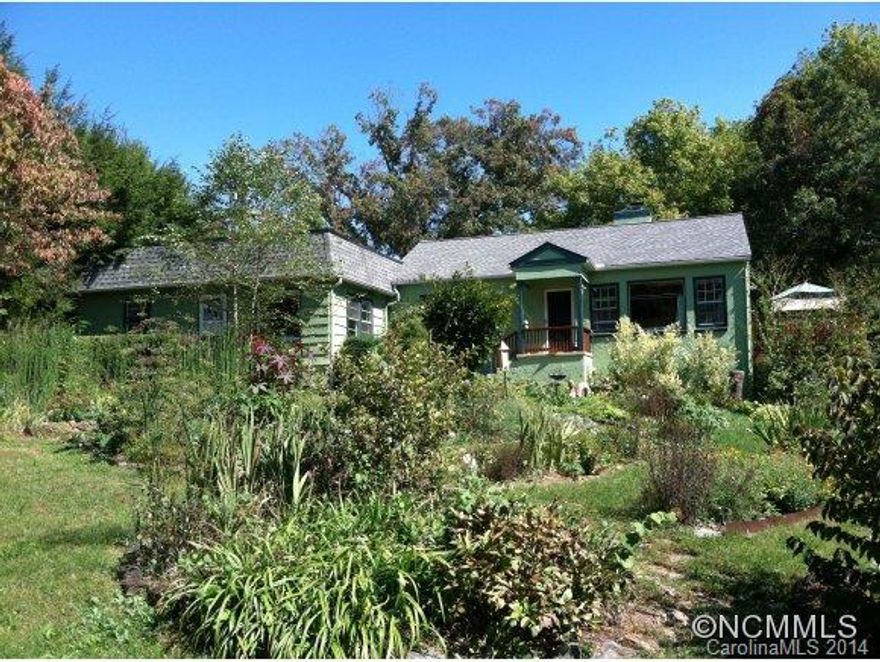 Rarer than hen's teeth! -This charming bungalow with attached cottage is perfect for family compound and offers abundant privacy as it is set back from the road. Close proximity to all city amenities.Extensive landscaping offers well developed food and flower garden with year round beauty.Fireplace with Jotul wood stove insert. Basement workshop has lots of room for extra storage.Tax listing has listed as single family.