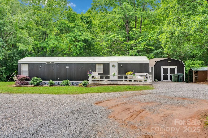 Tucked away on 3.32 acres, this 2BR/1BA home at 2289 McCloud St offers peaceful, private country living w/room to roam. The cozy 864 sqft home is move-in ready & full of charm. No neighbors across the street—just an 11.88-acre parcel & a 70-acre farm. Whether you're a car enthusiast, downsizing with big hobbies, a 1st-time buyer who wants elbow room, or someone who works from home and dreams of a backyard office—you’ll love what this property offers. Huge 30x40 Quonset hut makes an ideal garage & workshop. Two 2015 outbuildings (14x26 & 12x28)—one insulated & used as an office w/window A/C—great for remote work, art, or side hustles. Enjoy your morning coffee on the deck, work from your own backyard studio, office or tinker away in total quiet. Feels like country living, but you're just mins from Denver, NC. Bring your hobbies, your tools & your dreams—this one’s got the land, the charm & the freedom you’ve been waiting for.  This property comes with 2 lots. Home is on 1.82 and 1.50.
