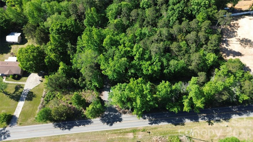 0.891 acres of land in unincorporated Mecklenburg County. Tucked within a peaceful, wooded setting, this property offers privacy and a natural backdrop for those seeking space away from the city while remaining conveniently close to I-485, local dining, and shopping.

A 2019 and 2021 perc test is on file indicating the property does not support a conventional septic system. Buyers are encouraged to explore alternative system options or consult with the county for updated evaluations and possibilities.

Whether you're looking for a private retreat, land investment, or a future homesite with vision, this property offers potential in a growing and sought-after area.