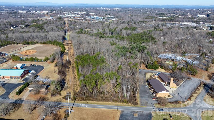 Nearly 12 acres of beautiful buildable land offering privacy, and natural surroundings. These (2) wooded parcels provide a peaceful setting while still being conveniently located very near local amenities. The property features gently rolling topography that offers opportunities for a private estate, family compound or recreational retreat. With road frontage and ample space for a home, driveway, and septic system, these tracts provide the perfect canvas to build your dream home surrounded by nature. Parcels will only be sold together.