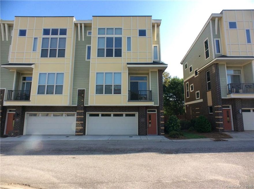 Outdoor space & a 2-car garage near uptown -- a rare find! NoDa end unit near parks, schools, entertainment, dining & more. Crown molding, wood floors, SS appliances, granite counters. Kitchen w/gas cooking, tile backsplash & breakfast bar island is open to LR-DR w/great natural light & balcony access. Both BRs & laundry on 3rd floor. Master has 2 closets (one a walk-in) & bath w/dual sinks & linen closet. Enclosed patio. Water, trash, lawn care, cable, Internet, & home security included!