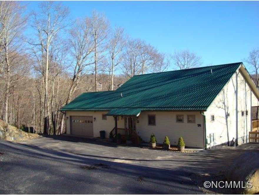 Beautiful mtn views from the well appointed home that is family sized, with high elevation & great access to country club & village amenities. Golf Membership available, mostly furnished, 2 full master suites w/4 bonus rooms , open and airy great room on main level, family room on lower level for kids & man cave, 580sqft garage on main level, private community water, all paved access, generator.MANY EXTRAS!!!Trying to locate septic permit