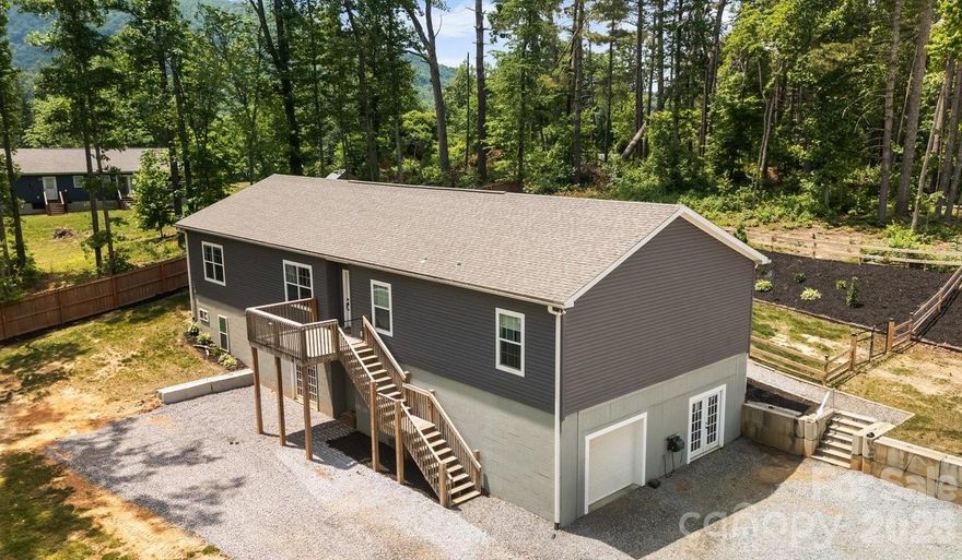 Expansive 4-Bedroom Home on 1.86 Acres with Endless Potential!

Welcome to 38 Fish Lake Drive, a stunning and versatile mountain-region property nestled in the highly sought-after Fletcher area of Henderson County. Perfectly positioned just outside the town limits and ETJ, this home offers the ultimate blend of convenience and financial savvy—enjoy quick access to all local amenities without the burden of additional city/town taxes.

Situated on a generous, unique 1.86-acre lot that encompasses both sides of Fish Lake Drive, this property provides the rare space and freedom to bring your Western North Carolina lifestyle dreams to life.

Interior Highlights: Open-Concept & Split-Bedroom Design

Step inside to a bright, expansive floor plan designed for modern living and effortless entertaining.
• The Chef’s Kitchen: The heart of the home features beautiful hard-surface granite countertops, an oversized island/breakfast bar, abundant cabinetry, and a sizeable walk-in pantry.
• Primary Suite Retreat: Located on its own wing for ultimate privacy, the primary bedroom boasts elegant tray ceilings, a spacious walk-in closet, and a luxurious en-suite bath complete with a garden tub & separate walk-in shower.
• Additional Rooms/Guest Rooms: On the opposite side of the home, you will find three additional spacious bedrooms sharing a pristine full bathroom—an ideal layout for guests or a dedicated home office.
• Main-Level Convenience: A dedicated laundry/mudroom sits just off the kitchen, serving as a functional transition zone with direct access to the back deck.
•      Open dining and living room, great for entertaining

Outdoor Living & Unmatched Versatility

• The Backyard Oasis: Transition seamlessly from indoor to outdoor living on the wonderful back deck. The fenced, private backyard is perfect for relaxing, entertaining, or letting pets roam safely.
• The Daylight Basement: Accessible via two personnel doors or a convenient roll-up garage door, this massive, open space is a blank canvas. Transform it into a workshop, home gym, art studio, or finish it out to add instant equity and square footage.
• The Bonus Acreage: Because the 1.86-acre lot extends across Fish Lake Drive, you have the unique opportunity and space to construct a detached garage, secondary workshop, or boat/RV storage.

Location Benefits

Enjoy the peace of country living without sacrificing convenience. This property puts you minutes away from shopping, dining, & parks, all while being centrally located to Asheville and Hendersonville.

You can see the property video here: https://www.youtube.com/embed/wzAchgwiFZI and you can take a Virtual Tour at this link:https://my.matterport.com/show/?m=JjnzhyryHsL

Shown by appointment only.