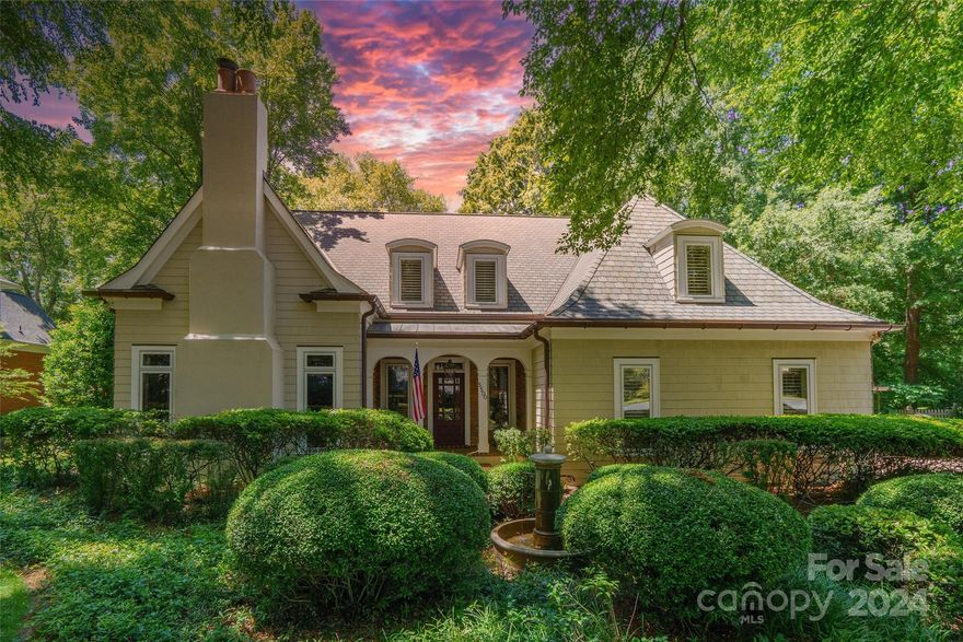 Welcome to your dream home in the heart of South Park! This stunning residence boasts unrivaled curb appeal, featuring a fountain that sets the tone for elegance. Step through the grand front entry into a world of luxury, where wood floors grace the main living areas, complemented by 2 cozy fireplaces in both the great room & living room. The charming kitchen includes a farmhouse sink, kitchen island w/ 2nd sink, granite countertops, SS appliances & abundant cabinet space. Retreat to the spacious primary bedroom on the main level, adorned with tray ceilings, offering a lavish ensuite bathroom with dual vanity, garden tub, & separate shower. Upstairs, discover additional bedrooms along w/ a bonus room. Indulge in outdoor living on the tiled and covered porch, overlooking the serene backyard with a large patio & brick fireplace—a perfect setting for hosting gatherings. Conveniently located near Ballantyne with easy access to Uptown, this exquisite home offers both luxury & convenience.