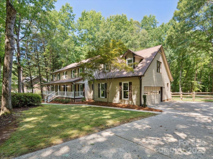 Welcome to this meticulously maintained home in the sought-after Providence Woods neighborhood. Situated on a private 1.69-acre lot, this beautiful property features a charming wrap-around porch and a large composite deck overlooking the fenced backyard—perfect for outdoor entertaining or peaceful mornings. Inside, you'll find 4 spacious bedrooms, a huge bonus room offering endless flexibility, and a walk-up attic for generous storage or future expansion. This home combines timeless charm, modern comfort, and ample space in one of the area's most desirable communities.
