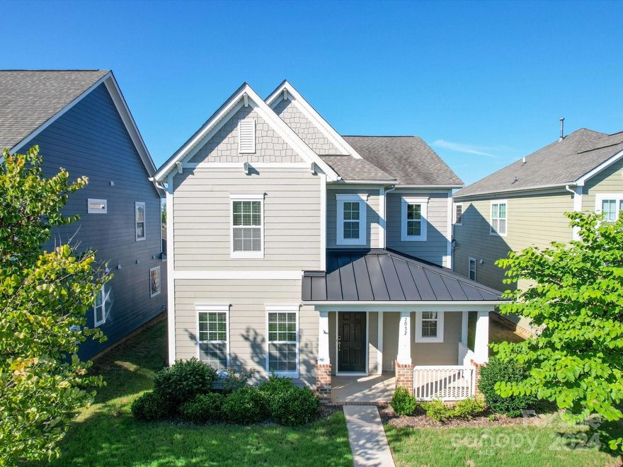 Imagine living in a home where every detail is crafted for luxury and convenience. This property features 4 bedrooms, 3.5 bathrooms, and 2,700 square feet of living space. This dual primary suite home in Tega Cay, SC, offers not one, but two primary bedrooms with private balconies and upgraded bathrooms. Picture yourself waking up to a serene morning on your private balcony or hosting friends in your spacious open floor plan kitchen. 

The kitchen includes granite countertops, a central island, and stainless steel appliances. Additional features are hardwood floors, ceramic tiles, a gas log fireplace, and two large decks. The detached 2-car garage is spacious. Located across from the community pool and park, and close to top-rated schools and local amenities, this home combines luxury and convenience. Close to Charlotte airport/ easy access to high way 77 and all major grocery stores. 
Schedule your viewing today and step into your dream home!