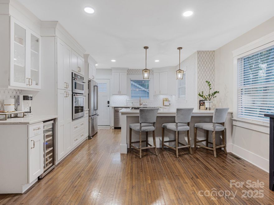 A stunning full remodel and addition that blends timeless charm with modern elegance for incredible value in Historic Wilmore. Turn key upgrades in 2021 include all-new electrical, plumbing, roofing, HVAC, structural engineering, dual hot water heaters, top-tier insulation, and an encapsulated crawl space equipped with a dehumidifier. Boasting dual primary suites, lavish bathrooms, gourmet kitchen that flows seamlessly into the open living room, ample storage and closet space. Additionally, a separate-access finished basement that is perfect for generating rental income or accommodating family and guests. A private side porch leading to a large, flat, fully fenced lot with a beautiful paver patio and fire pit ledge for outdoor enjoyment. This home is ideal for entertaining inside and out. All enhanced by prime walkability to the upcoming Silver Line light rail and vibrant South End.