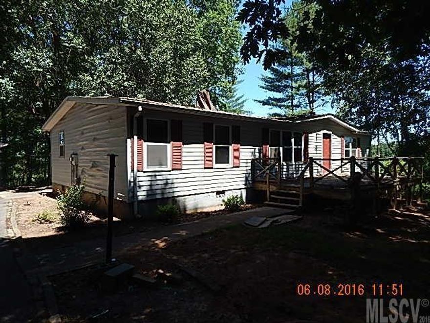 3 br 2 ba doublewide in need of repairs. Double detached garage. Front deck will need repairs. In need of a new roof and ceiling repairs from previous roof leak. Will make a great rental, in a good location. Seller and or its agent make no representation to condition of property expressed and or implied. Sold as is.