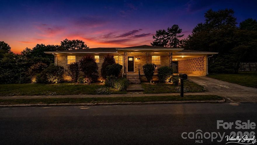 This charming full-brick ranch sits on a desirable corner lot and offers a great blend of character and functionality. The backyard is perfect for entertaining, complete with a dedicated grill area and gas line for easy outdoor cooking. Enjoy relaxing on the large covered front porch overlooking mature, well-maintained landscaping.

Inside, the updated kitchen features granite countertops, a new stainless steel oven/range, and a stylish mix of white upper and gray lower cabinets. Hardwood floors run through the main living areas and bedrooms. The retro-style bathroom adds unique charm with mint tile, an original porcelain sink, and a spacious linen closet.

Additional highlights include a lower-level garage, pull-through carport, rear parking options, and a versatile basement space ideal for a workshop or storage.

Conveniently located near downtown Landis with easy access to Salisbury, Kannapolis, and Concord—this home offers comfort, character, and convenience all in one.