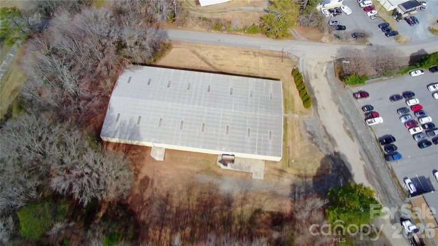 ±20,000 SF warehouse in the Indian Trail industrial corridor with Heavy Industrial (H-I) zoning and ample outdoor storage area. The building is predominantly warehouse with approximately ±760 SF of office, including a bathroom with shower and a den/break area, ideal for users who want functional industrial space without excess office build out. Clear height is approximately 14’ at the center and 10’ at the edges. The warehouse includes two 10’ x 10’ roll-up doors with exterior dock platforms, including a combination dock/drive-in loading configuration. Power, 3 Phase, 120/208V AC.

Seller owns an additional ±1.8 acres of contiguous Heavy Industrial land that could be sold separately.

Quick access to US-74, Old Monroe Rd, and the US-74 Bypass, with convenient drive times to Matthews, Ballantyne, Uptown Charlotte, and Monroe.

A rare chance to buy a mostly wide-open warehouse with minimal office and H-I zoning in one of the most in-demand industrial pockets of the Charlotte region.