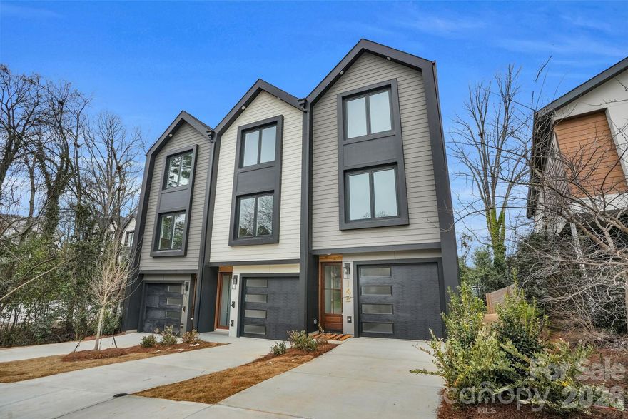 Modern Luxury in Historic Biddleville: Sleek modern design and urban convenience in this new residence, located in the heart of the vibrant Biddleville neighborhood. Just minutes from Uptown Charlotte, local shops and dining. This home offers striking modern design with the ultimate privacy. Rare wooded backyard, private wood fence-perfect for mornings or evening entertaining. The floor plan features 3 spacious bedroom each accompanied by its own private, en-suite bathroom, offering luxury and convenience. Premium finishes, rich hardwood flooring throughout the entire home-no carpet in sight. Custom-wood staircase serves as a central design piece, integrated staircase lighting. Kitchen has upgraded cabinets, 12ft island, Kitchen Aide appliances with built in wall oven and microwave, Kitchen Aide side by side refrigerator. Huge 8ft sliding glass doors off the kitchen to a deck. Family room has a fireplace, large windows, ceiling fan and extra LED lighting. The upper level has primary bedroom and guest bedroom with vaulted ceilings. Instant access to major highways and the light rail for a trip into the center city. Agent is owner.