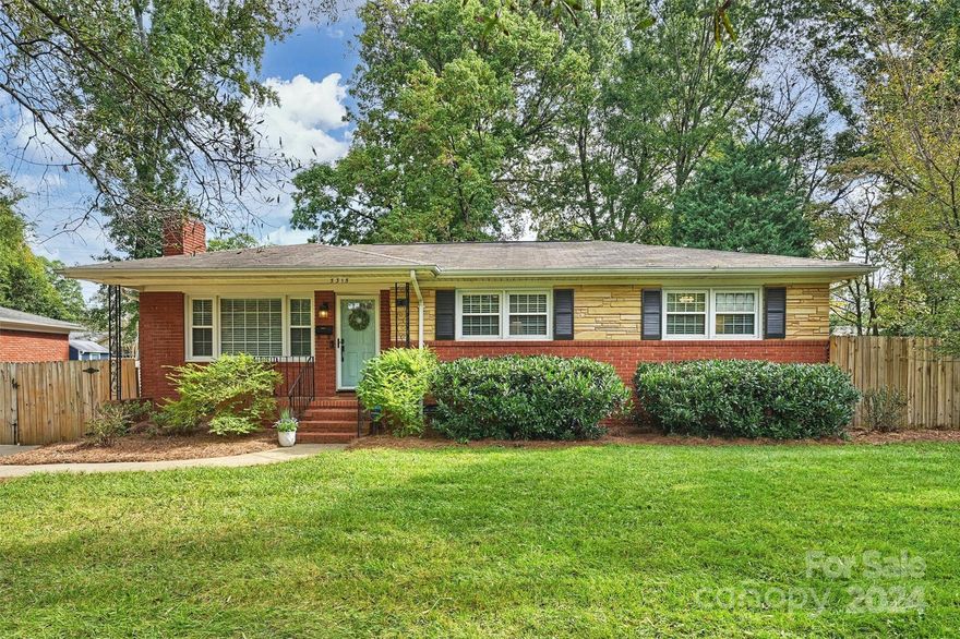 Welcome to this beautifully renovated ranch nestled on a classic tree lined street in the sought after neighborhood of Montclaire! Home features a desirable floorplan allowing for comfortable living & effortless entertaining! Enjoy the spacious yet cozy LR w/a fireplace flanked by bookcases. LR flows seamlessly into the large dining area & kitchen. The updated kitchen boasts quartz countertops w/to the ceiling cabinetry, ample counter space & an oversized peninsula providing addt'l seating. Step down into the dreamy sunroom which is the perfect flex space, ie. sitting area, office, playroom, etc! Features drop zone area near rear entry & walk-in laundry/storage room, perfect for a pantry! Primary bedroom offers dual closets & the home features 2 tastefully updated bathrooms. Outside you’ll find the most serene, private, fully fenced back yard w/paver patio & fire pit - perfect for enjoying the fall weather! Minutes to all the shops & dining that LoSo/SouthEnd & SouthPark have to offer!
