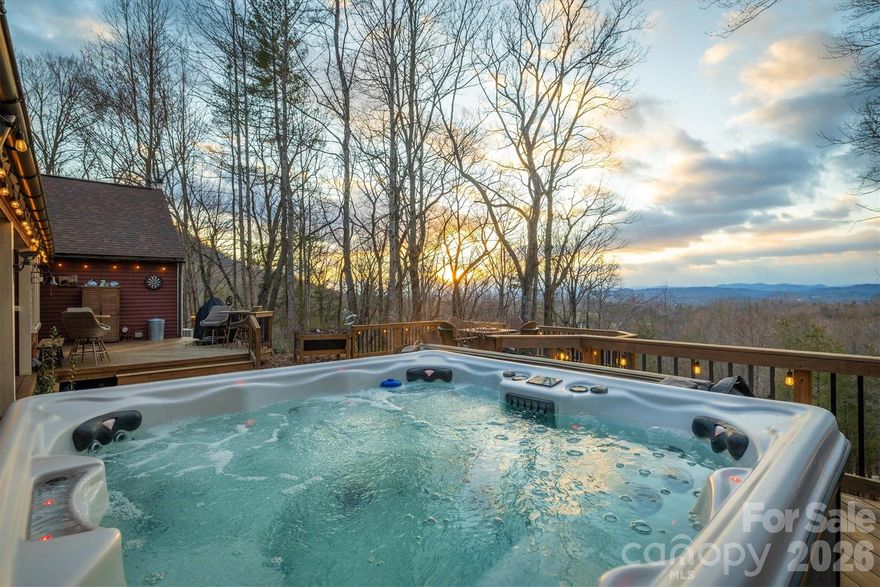 Tucked away on over 5.5 acres of pure privacy, this breathtaking mountain retreat offers a rare combination of timeless character, modern updates, and unforgettable long-range views of Grandfather Mountain and surrounding peaks. From the moment you arrive, the home showcases exceptional curb appeal with its warm exterior tones, inviting wraparound decking, and elevated setting that captures both sunset skies and peaceful wooded surroundings.

Designed to embrace the beauty of its natural setting, the outdoor living spaces are truly special. Expansive decks provide multiple areas for entertaining, relaxing, or simply soaking in the panoramic mountain scenery. A beautiful brick paver patio overlooks the layered Blue Ridge views, creating the perfect backdrop for morning coffee or evening gatherings. The fenced-in backyard adds functionality and flexibility, while the hot tub conveys and offers a private place to unwind under the stars. An above-ground pool with surrounding deck space further enhances the outdoor experience, making this property ideal for both quiet retreats and hosting. 

Inside, the home is equally impressive. A stunning oversized brick wood-burning fireplace anchors the living space, creating warmth and character that perfectly complements the rich wood floors and detailed trim throughout. The interior blends classic craftsmanship with thoughtful modern upgrades, including brand new prairie-framed Andersen windows and doors that flood the home with natural light while perfectly framing the mountain views. The kitchen features elegant quartz countertops, updated modern appliances, custom cabinetry, and stylish open shelving, offering both functionality and charm. The dining area is highlighted by a statement chandelier and custom woodwork, creating an inviting atmosphere for gatherings.

Additional living spaces provide versatility and comfort, including a dedicated office nook, spacious bedrooms, and beautifully updated bathrooms. Every corner of the home reflects attention to detail and quality craftsmanship.

For those needing additional space, the impressive detached garage offers four parking bays along with an additional room at the back that can serve a variety of purposes workshop, studio, hobby space, or extra storage. Above the garage, a separate flex room provides even more possibilities, whether used as a guest suite, home office, recreation room, or private retreat.

While this property feels like a secluded mountain sanctuary, it remains conveniently located just a short drive to App Ski Mountain, as well as the shopping, dining, and year-round activities in Boone and Blowing Rock. Whether you’re seeking adventure on the slopes, hiking scenic trails, or enjoying charming downtown streets, everything the High Country has to offer is within easy reach.

This is more than just a home, it’s a one-of-a-kind mountain escape where privacy, views, character, and convenience come together beautifully!!