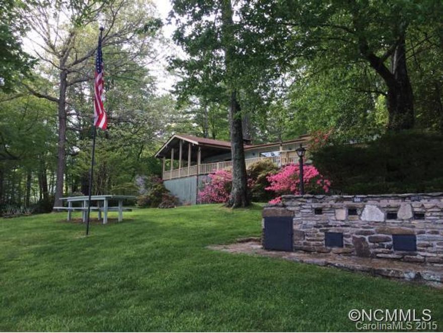 This absolutely prime setting is one of Lake Toxaway's finest flat, double lakefront lots with 260 feet of lake frontage, gorgeous large trees, and well-kept home. This site has a magnificent south and westerly lake view of the extensive open water and beautiful sunsets making it one of the most desirable properties on the lake. No septic records available.