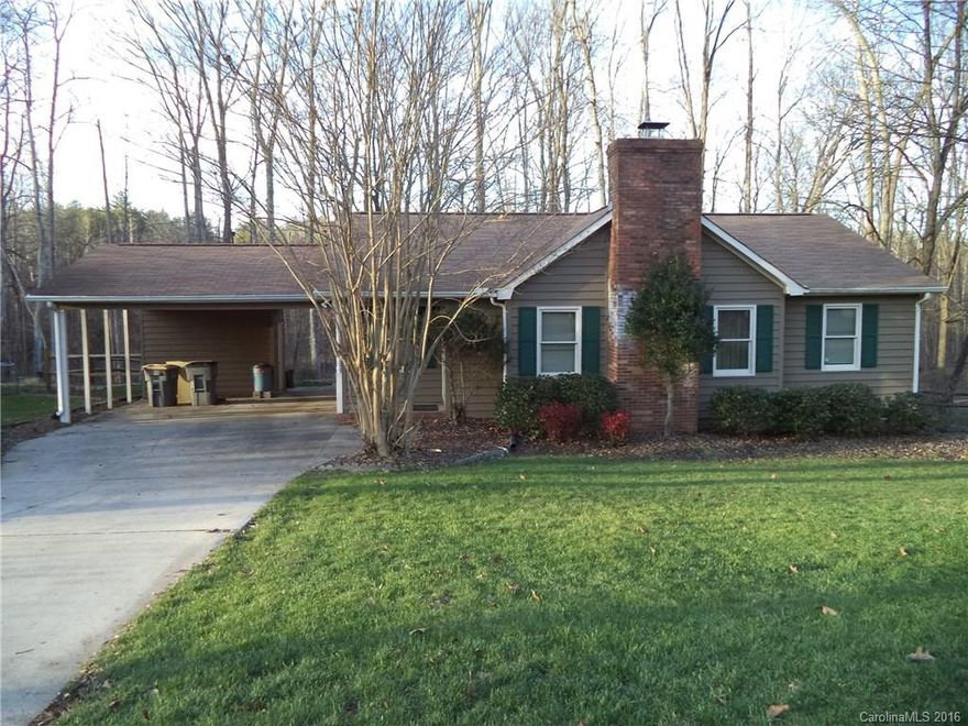 Beautiful home on large wooded .66 acre lot. Feels like you're in the country but close to everything! Kitchen has updated countertops and tile backsplash, new stove (2014) and dishwasher (2013). Beautiful, new wood laminate flooring in Kitchen, Dining and Living room, ceramic tile in both baths. HVAC new in 2008. Abundant storage, walk in closets. Wonderful 4 season porch offers so many options, partially fenced yard. Fresh exterior paint. Large storage building and storage room in carport.