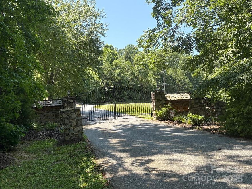 Build your dream home or vacation getaway in the desired gated community of The Views at Woodland Hills. This private, picturesque community is conveniently located a short distance from I-40 to Asheville/Hickory and bustling downtown Marion. Lot 13 is gently rolling, offering several building sites and boasting seasonal mountain views. Just up the road is the community pond, pavilion, and clubhouse. The minimum square footage building requirement is only 1,250 with low HOA fees....and SHORT-TERM RENTALS ARE ALLOWED!! Lots in this subdivision are rarely available, so schedule your showing today!!