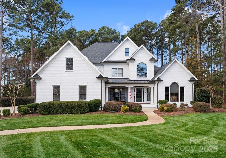 Over $200k in upgrades since purchasing 2 years ago. Nestled on a serene .85-acre cul-de-sac lot in the prestigious community of The Point, this beautifully updated home offers a rare blend of modern comfort, privacy, and lake lifestyle—complete with a deeded boat slip. Timeless elegance meets functionality with rich hardwood floors, detailed millwork, and a sun-filled, open floor plan. The gourmet kitchen features updated cabinetry, quartz countertops & stainless appliances. The main-level primary suite includes a luxurious ensuite bath with soaking tub and walk-in shower. Upstairs, two staircases lead to three additional bedrooms, two full baths, and a spacious bonus room. Enjoy outdoor living with a screened porch, patio with firepit & a lush, landscaped backyard perfect for relaxing or entertaining. Located in one of the area’s most prestigious communities, you'll enjoy lake access, golf, tennis, dining & more. Move-in ready, meticulously maintained ideal for enjoyment year round!