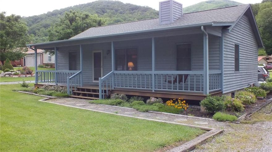 Adorable cozy home on level lot easy access paved frontage check it out today.  Split bedroom plan each with private bath  2 bedrooms and 2 baths. Great screened in porch good walking area with  side walks very level. Close to town and all attractions  extra lot included in price  Check this out today