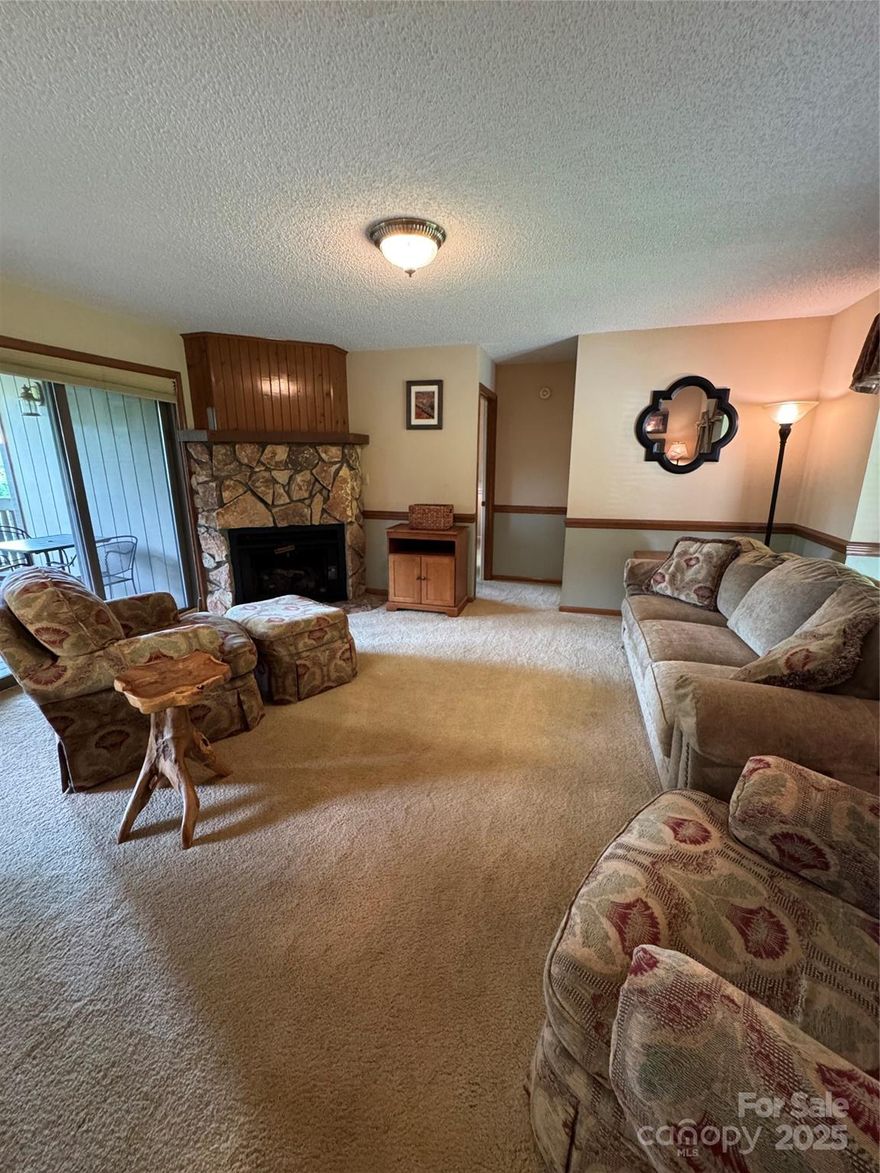 Prime Investment Opportunity! This beautiful, ground-level condo in Chestnut Ridge on Sugar Mountain offers unmatched convenience with direct walk-in access. Just steps from the slopes, it comes furnished and move-in ready. Inside, you’ll find two bedrooms and two bathrooms, each with en suite access. One bedroom boasts a spacious walk-in closet, while the other features a luxurious bathroom with a tiled shower and dual-sink vanity. The kitchen offers a charming breakfast bar and separate dining area, while the inviting stone gas log fireplace in the living room creates the perfect cozy atmosphere. Additional perks include a washer and dryer, an exterior storage closet right outside the entry, and a generous deck showcasing stunning seasonal and year-round mountain views. Don’t miss your chance to purchase this property before ski season kicks off! Spring, Summer and Fall rentals are 7 night minimum.  In the Winter there is a 2 night minimum.