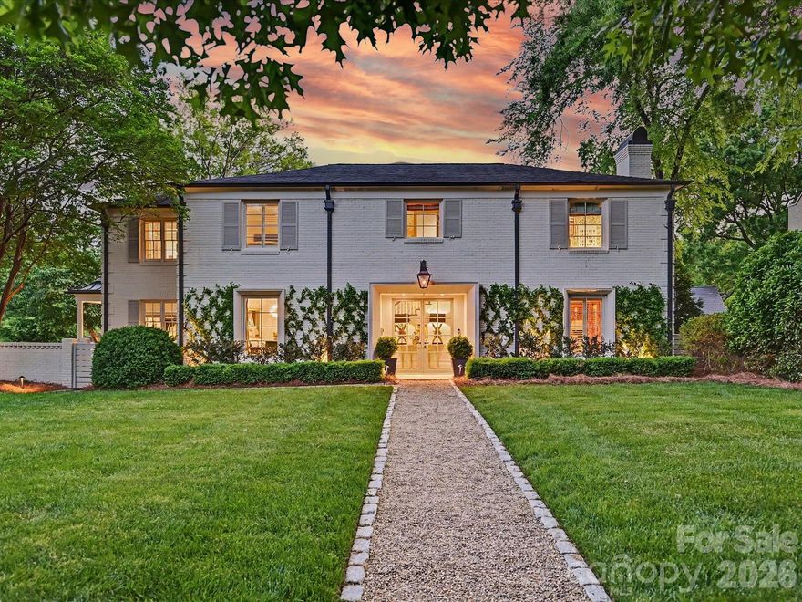 Located on one of Myers Park’s most desirable streets, 2228 Wellesley Avenue is a beautifully executed home that balances classic architecture with thoughtful, modern updates. Positioned on a corner lot with exceptional privacy and mature landscaping, the property offers both presence and livability in equal measure.

The interior is defined by beautiful millwork, ample natural light and a seamless flow between formal and informal spaces. A gracious foyer leads to well-proportioned living and dining rooms, while the main living areas open seamlessly for everyday living and entertaining.

The kitchen has been beautifully updated with custom cabinetry, marble countertops, a generous center island, a large breakfast area, and a built-in bar, connecting effortlessly to the great room. Supporting spaces are thoughtfully designed, including a functional mudroom with sink, a secondary dishwasher and laundry area on the main level, as well as an additional laundry located upstairs for convenience.

Upstairs, the primary suite is a quiet retreat with an inviting sitting room, large spa-like bath and ample closet space. Secondary bedrooms are bright and appropriately scaled, accompanied by updated baths and a versatile bonus room and secondary staircase.

Designed with entertaining in mind, the outdoor spaces are a true highlight. A covered porch with fireplace overlooks a fully turfed backyard complete with a built-in grill and patio—creating a private, low-maintenance setting for year-round enjoyment.

A rare opportunity to own a turnkey home in a premier Myers Park location, just minutes from high-end shopping, and gourmet dining.