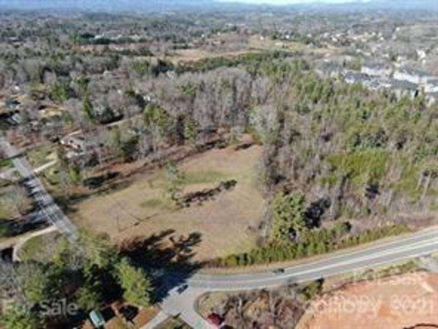 POTENTIAL COMMERCIAL!!!  GREAT POTENTIAL FOR THIS PROPERTY WITH THE POSSIBILITY OF ADDITIONAL ACREAGE. PUBLIC WATER AND NATURAL GAS ON POPERTY. VERY GENTLE TOPOGRAPHY. LOCATED CLOSE TO WALMART, LOWES, FUTURE HOBBY LOBBY AND MARSHALLS. CLOSE TO 25/70. A FEW MINUTES TO DOWNTOWN WEAVERVILLE AND ASHEVILLE.