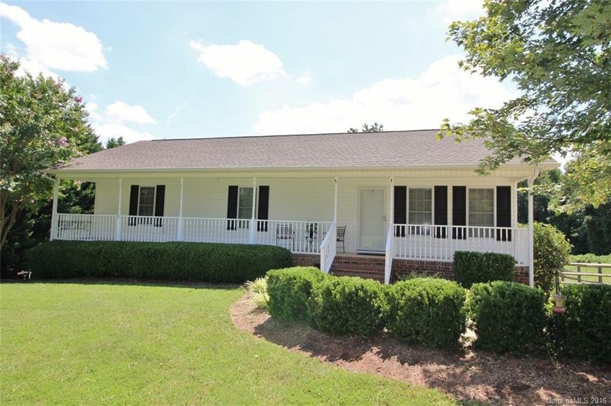 Cute Country Living in Clover! Enjoy the breeze from the rocking chair front porch! Wide plank laminate floors and cozy colors invite you in. Open floorplan great for entertaining. Customized butcher block kitchen counters, custom cabinets and beadboard accents plus a sunroom/flex space. The spacious Master overlooks the private fenced yard and cute barn shed.