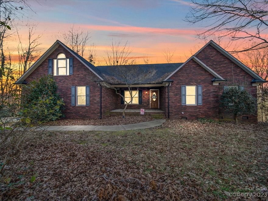 WELCOME HOME to this beautiful custom built ONE OWNER full brick home in the highly sought after Willow Creek neighborhood! The home sits on 0.67 acres & also includes the adjacent vacant lot (containing 0.53 ac) for plenty of privacy! Enjoy your morning coffee on the large open front porch or rear deck.  2 car garage, 3 bedrooms, 2 baths, vaulted ceilings in family room with a gas fireplace for cozy winter nights. Vaulted ceiling in the primary bedroom and double vanities with a large jetted tub in the primary bath.  Solid wood kitchen cabinets, HUGE laundry room with included second refrigerator and a great upstairs bonus room for toys or a man cave. The unfinished basement has plenty of room for storage or future expansion! New Trane Hybrid HVAC was installed 01/2021 with transferable warranty. Come check out this beautiful private home before its gone!