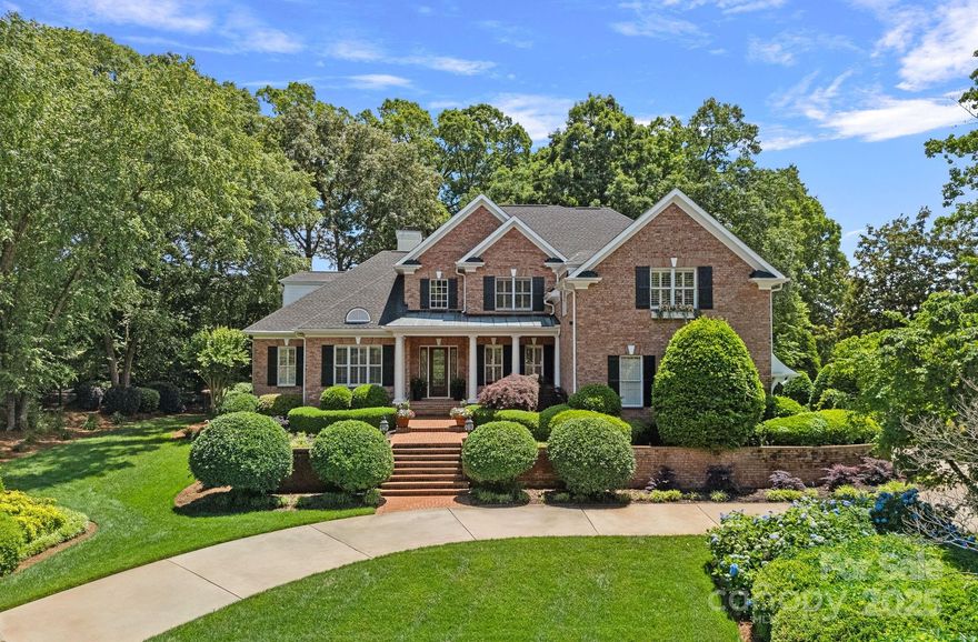 Experience luxury living in The Peninsula on one of its largest, most private lots—nearly an acre—overlooking the 2nd hole of the newly renovated golf course with peaceful water views. This stately brick home offers nearly 4,700 sq. ft. with 6 bedrooms, 4.5 baths, and a host of thoughtful updates. The renovated chef’s kitchen features quartz countertops, high-end appliances, a gas range, beverage drawers, and an ice maker, opening to a cozy breakfast area and keeping room with fireplace. The main-level primary suite is a true retreat with a spa-inspired bath, freestanding tub, dual closets, and access to a covered patio with in-ground spa. Enjoy fresh interior paint, refinished hardwood floors, updated lighting, a two-story great room, main-level office with full bath, circular drive, and expansive backyard with HOA-approved pool plans. Ideally located near The Peninsula Club and Safe Harbor Yacht Club, this is a rare opportunity in one of Lake Norman’s premier communities.