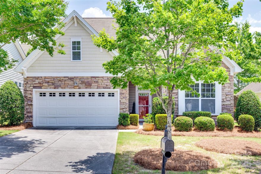 Welcome to this beautiful 1.5-story home in a highly sought-after Tega Cay neighborhood! This thoughtfully designed residence offers a spacious open floor plan with hardwood floors throughout the main living area and primary bedroom. Enjoy two bedrooms and two full bathrooms on the main floor, along with a dedicated office and laundry room for added convenience. Upstairs, you'll find a third bedroom, an additional full bathroom, and a versatile loft space—perfect for guests or a home gym. Relax on the screened-in back porch and enjoy maintenance free lawn care. New HVAC July 2025. November UPDATES include NEW stainless steel appliances,  fresh paint throughout the main level and garage, new carpet in secondary bedroom on main floor. Don’t miss the opportunity to live in one of Tega Cay’s most desirable communities!