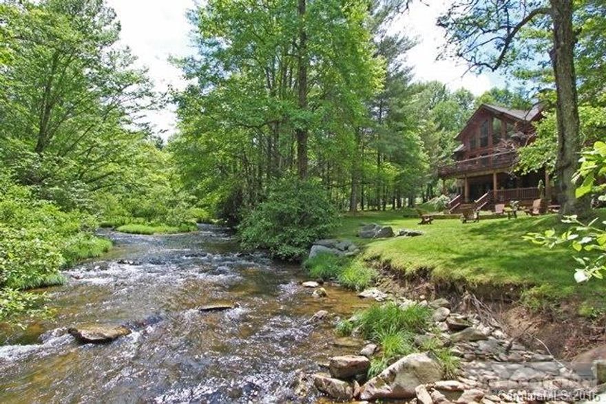 One of the most impressive log estates in The High Country, on 2 Boone Fork Creek waterfront lots! Park-like grounds, end of private drive, easy access b/w Boone/Banner Elk in gated Twin Rivers. Each room has views of Boone Fork Creek, (tributary of Watauga River) = fly fishing! Ideal floor plan, walk-in level living, Great Room, grand stone fireplace, 4 Master Suites, 4 car gar., 1/2BAs, Australian Cypress floors, gourmet kitchen, & fire-pit on riverbank. Great for year-round or vacationing!