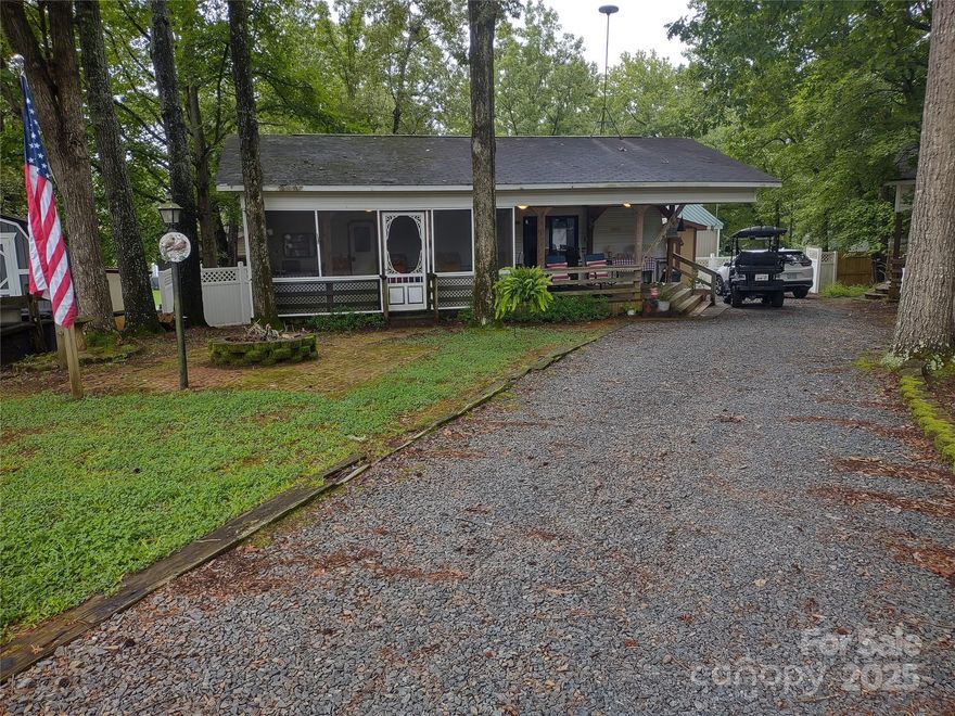 LOCATION, LOCATION, LOCATION, Large cul-de-sac level lot, comes with a 36ft Forest River Sandpiper Camper 2 slides.  Several updates recently, newer LVP flooring, updated electrical 100 amp service, 40 gal electric water heater, full size refrigerator, sleeper sofa, camper king size bed, this unit comes with lots of space and storage throughout.  12X18 screen porch, 12X18 open covered porch, 10X8 storage building with power additional refrigerator to remain, firepit, plenty of parking, partially privacy fencing.