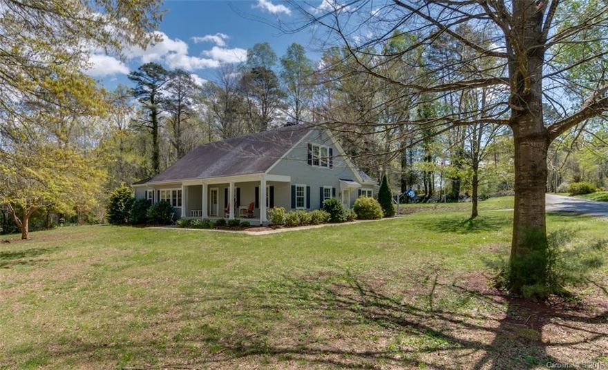 Charming, custom-built w/hardwoods, FP, many built-ins & closets. Ext freshly painted, front porch + screened porch, 2 carports, circular drive & 1.02 ac corner lot. Main level offers master bedrm & 1/2 bath, a guest bedrm, LR, formal DR, kitchen & breakfast area, laundry, full bath & a study/den. Upstairs is a large bedroom & living area with kitchenette, a full bath + an attic/bonus area that could be finished. The basement is ideal for a workshop or storage area with shelving.