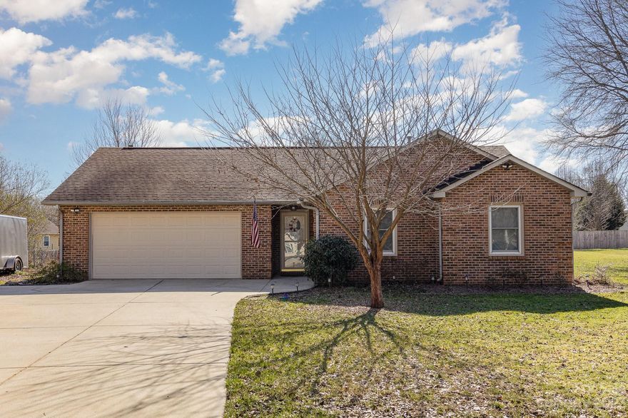 1807 Clear Hill Court invites its next fortunate owner to experience one-level country living in a charming full-brick ranch-style home. Spacious .49-acre lot at the end of a quiet cul-de-sac, this property ensures privacy with no through traffic and no HOA dues. The home features a 2-car garage and a relaxing covered deck, perfect for hosting gatherings. Step inside to discover a newly remodeled kitchen adorned with stainless steel appliances, solid wood cabinets, and quartz countertops. The main living area boasts elegant Mohawk flooring, creating a seamless and stylish aesthetic. Enjoy cozy evenings by the fireplace, adding warmth and ambiance to your home. Conveniently situated near major highways, offering easy access, making commuting a breeze. Additionally, its just minutes away from shopping, dining, and the vibrant downtown Monroe, providing a perfect blend of comfort and accessibility.