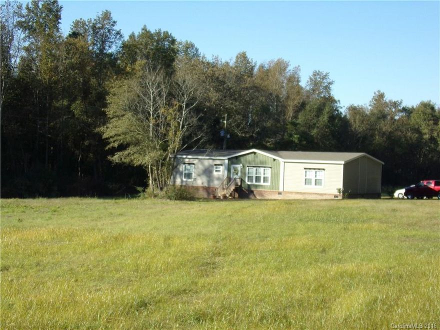 Don't miss this beautiful custom Scotbilt DW manufactured home, located on 15+ acres of land!  The open floor plan features a double tray ceiling in the living area, beams in the kitchen/dining with upgraded cabinets,  breakfast bar and much more. The split floor plan affords lots of privacy to the spacious master bedroom/ master bath, with oversized shower, and deep soaking tub.  Add a pasture fence and bring your horses or enjoy the room to roam on this attractive parcel with branch border.