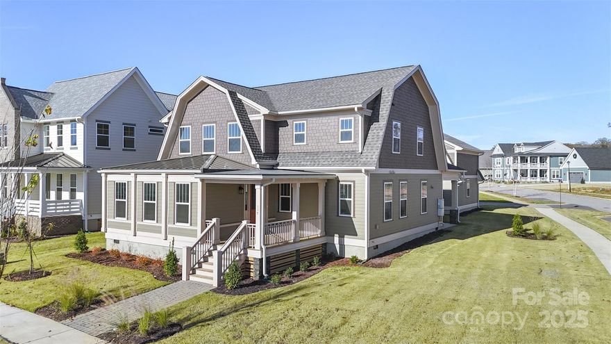 Welcome to the Talia – where style meets functionality in one of the most desirable communities, Riverwalk! This stunning home features an open-concept design perfect for everyday living and effortless entertaining. The main-level primary bedroom offers privacy and convenience, while upstairs boasts a spacious secondary suite and two additional bedrooms. A two-car garage with overhead storage adds even more flexibility. Topped with a striking gambrel-style roofline, the Talia stands out with curb appeal and character. Don’t miss your chance to own in Riverwalk – a vibrant neighborhood known for its charm, lifestyle, and unbeatable location!