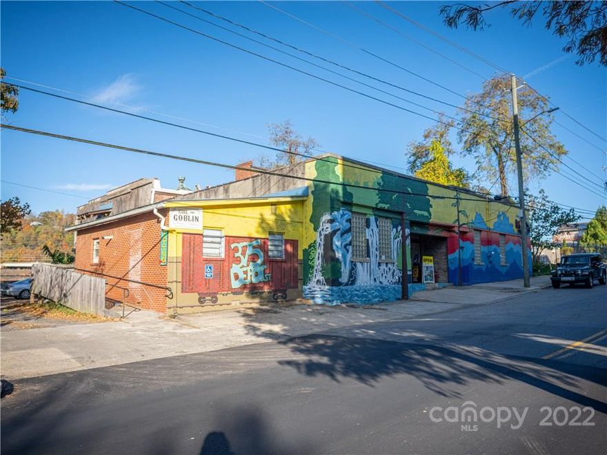 Retail property for sale in River Arts District of Asheville. 375 Depot St has gravel parking with approximately 15-20 parking spaces in a gravel lot. Property has varying ceiling heights, flooring types (wood, concrete, tile) and is two stories. Property is home to Trackside Studios. Many of the tenants have occupied the property for 10+ years. Tenants have leases in place at the property with options. Please do not disturb tenants. Hundreds of apartment units are being developed nearby in the RAD. The RAD has several miles of greenways that run parallel to the French Broad River, numerous breweries, and is home to multiple parks  Property has had recent HVAC, roof upgrades.